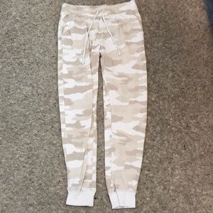 Tan, cream, and white sweatpants